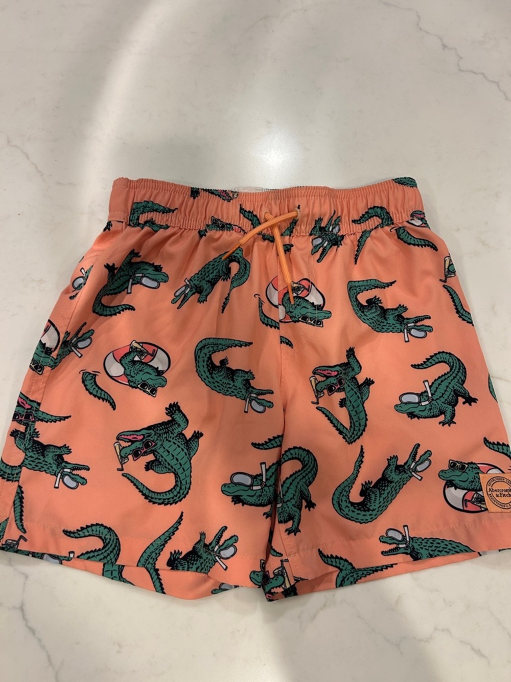 abercrombie kids Peach Swim Trunks with Green Alligator Print 7/8